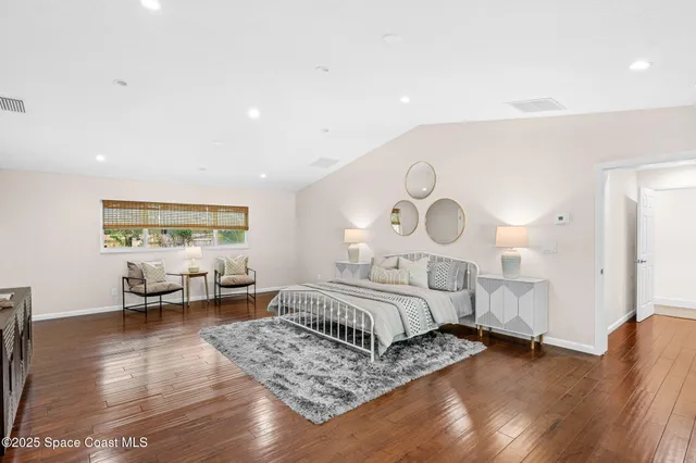 a bathroom with a granite countertop sink a toilet and a mirror