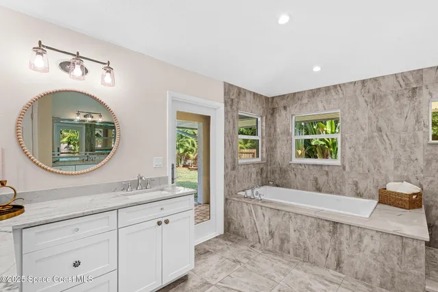 a view of a swimming pool with a yard and plants