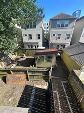2115 State Street Houston, TX 77007 - Photo 11 of 12 a view of a roof deck with dining table and chairs with wooden floor