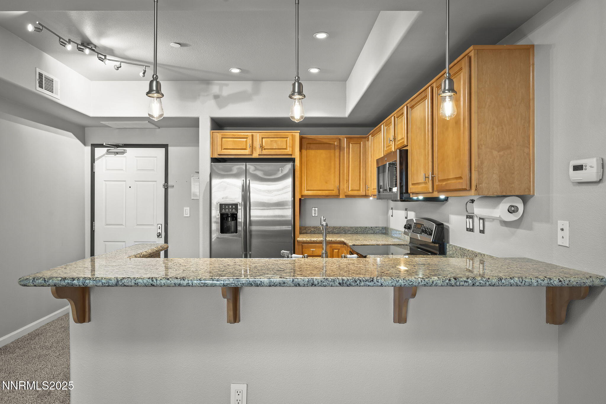 200 West 2nd Street, Unit 502 Reno, NV 89501 - Photo 15 of 35 a bathroom with a granite countertop sink and a mirror