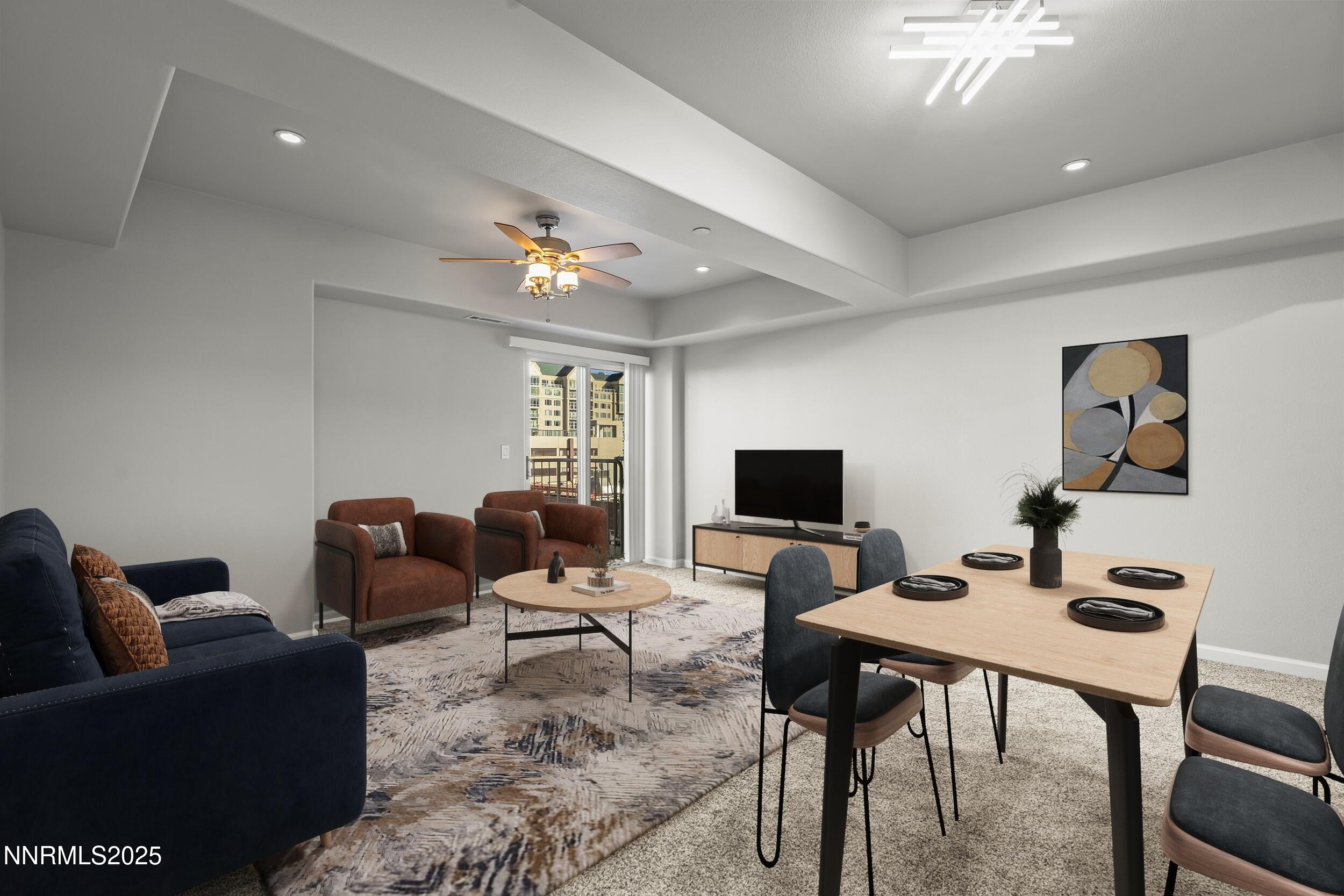 200 West 2nd Street, Unit 502 Reno, NV 89501 - Photo 9 of 35 a living room with furniture and a flat screen tv