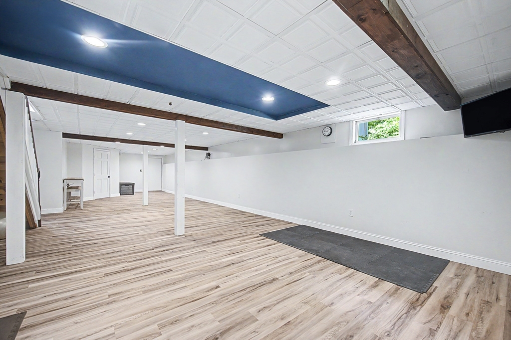 4 Dicarlo Road Hopkinton, MA 01748 - Photo 29 of 41 a view of an empty room with wooden floor