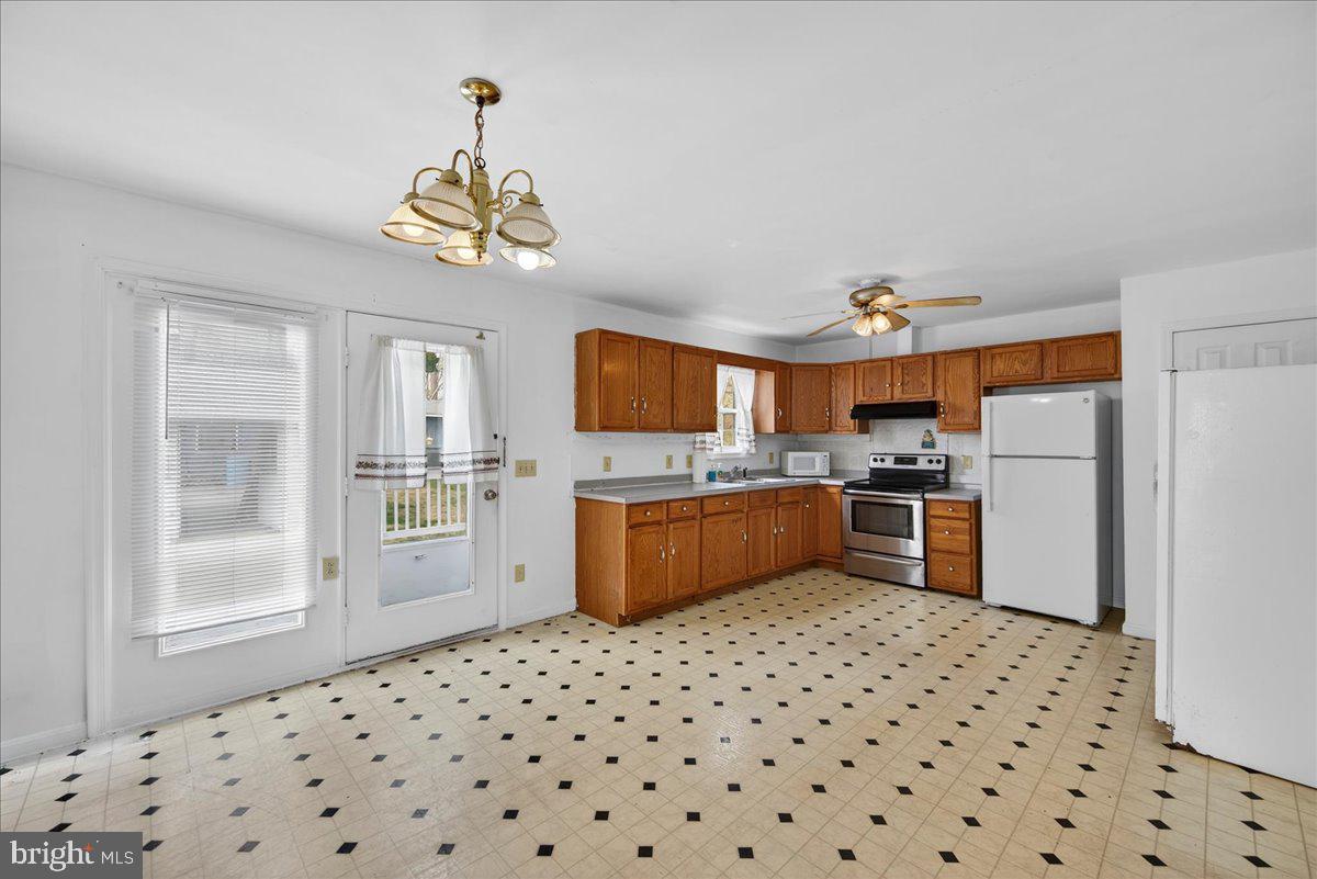 28042 Rapidan Road Rapidan, VA 22733 - Photo 11 of 72 a kitchen with stainless steel appliances a refrigerator and a stove top oven