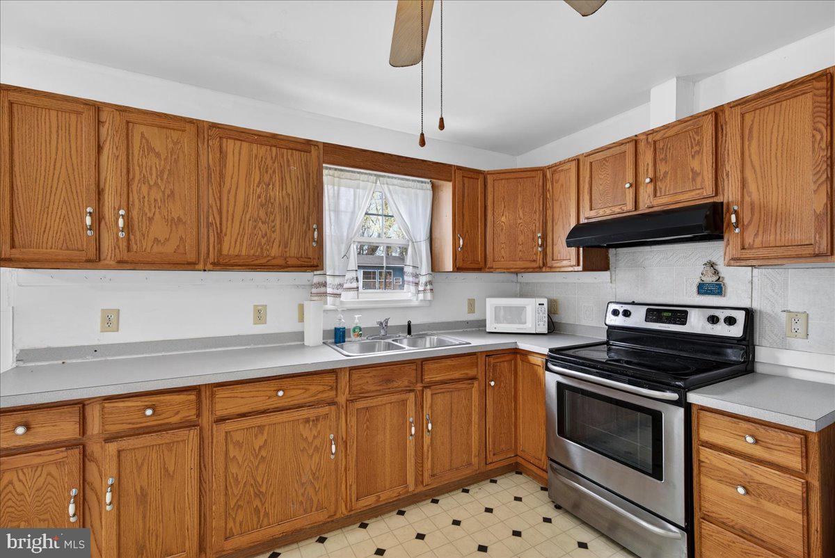 28042 Rapidan Road Rapidan, VA 22733 - Photo 15 of 72 a kitchen with sink cabinets and window
