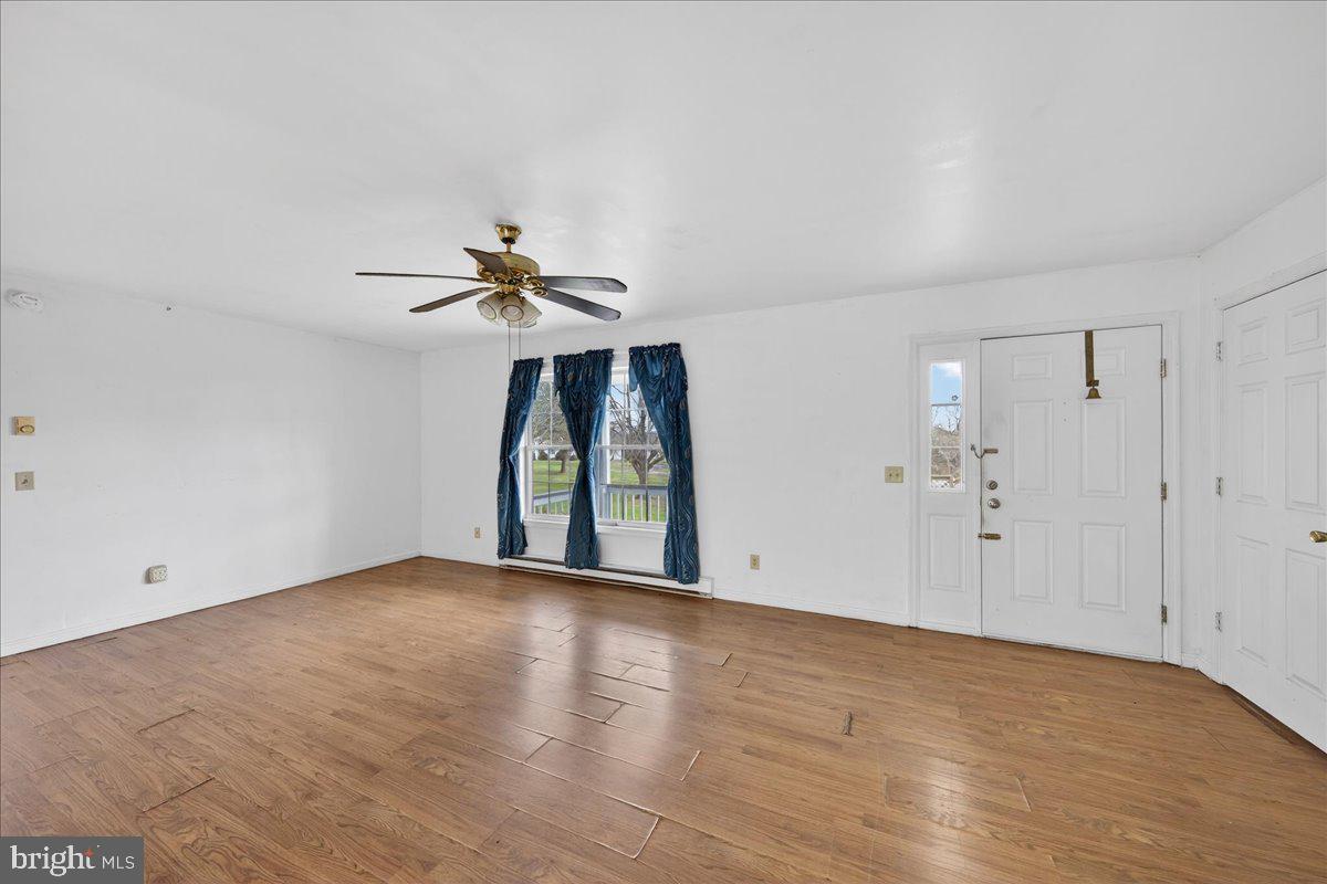28042 Rapidan Road Rapidan, VA 22733 - Photo 18 of 72 wooden floor in an empty room with a window