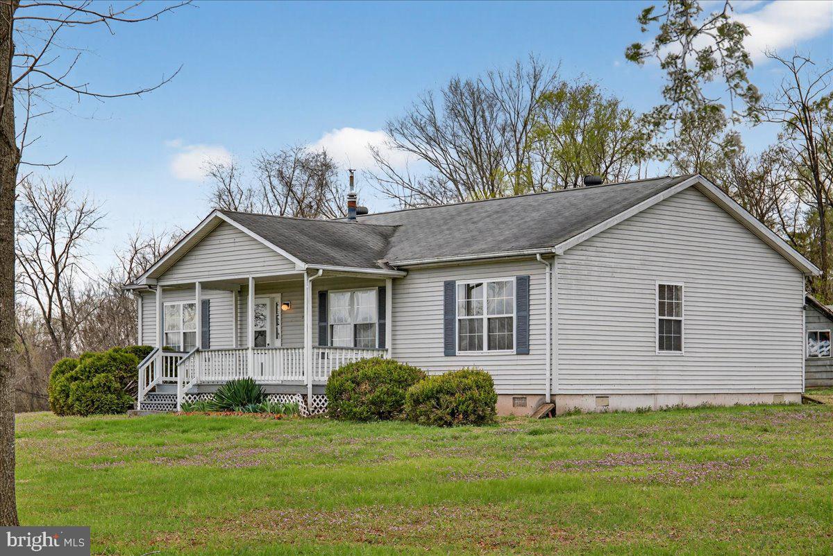 28042 Rapidan Road Rapidan, VA 22733 - Photo 2 of 72 a front view of a house with a garden