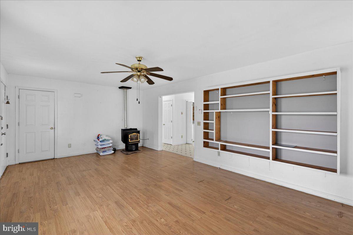 28042 Rapidan Road Rapidan, VA 22733 - Photo 21 of 72 a view of room with wooden floor and ceiling fan