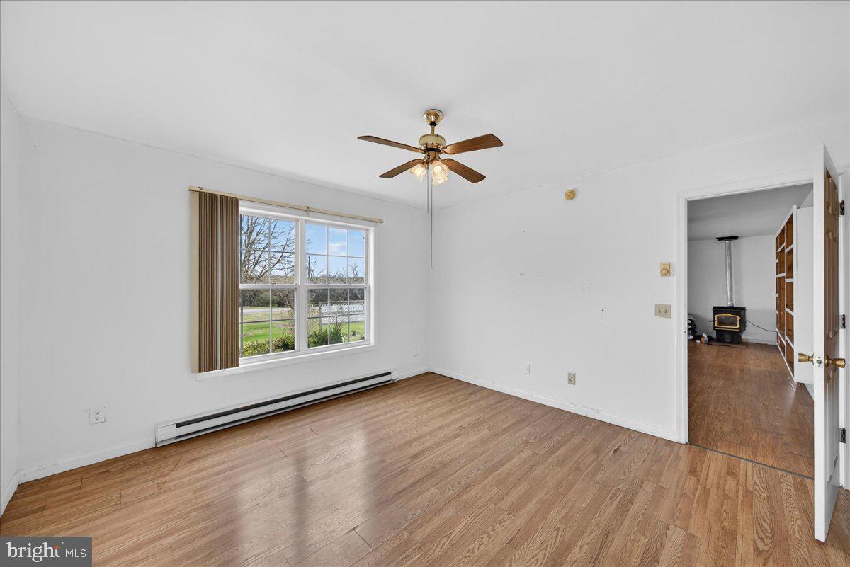 28042 Rapidan Road Rapidan, VA 22733 - Photo 24 of 72 wooden floor in an empty room with a window