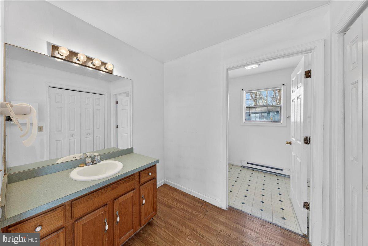 28042 Rapidan Road Rapidan, VA 22733 - Photo 25 of 72 a bathroom with a sink vanity granite and a mirror