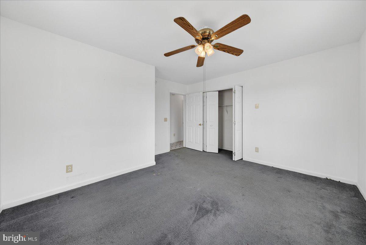 28042 Rapidan Road Rapidan, VA 22733 - Photo 32 of 72 an empty room with a ceiling fan and a window