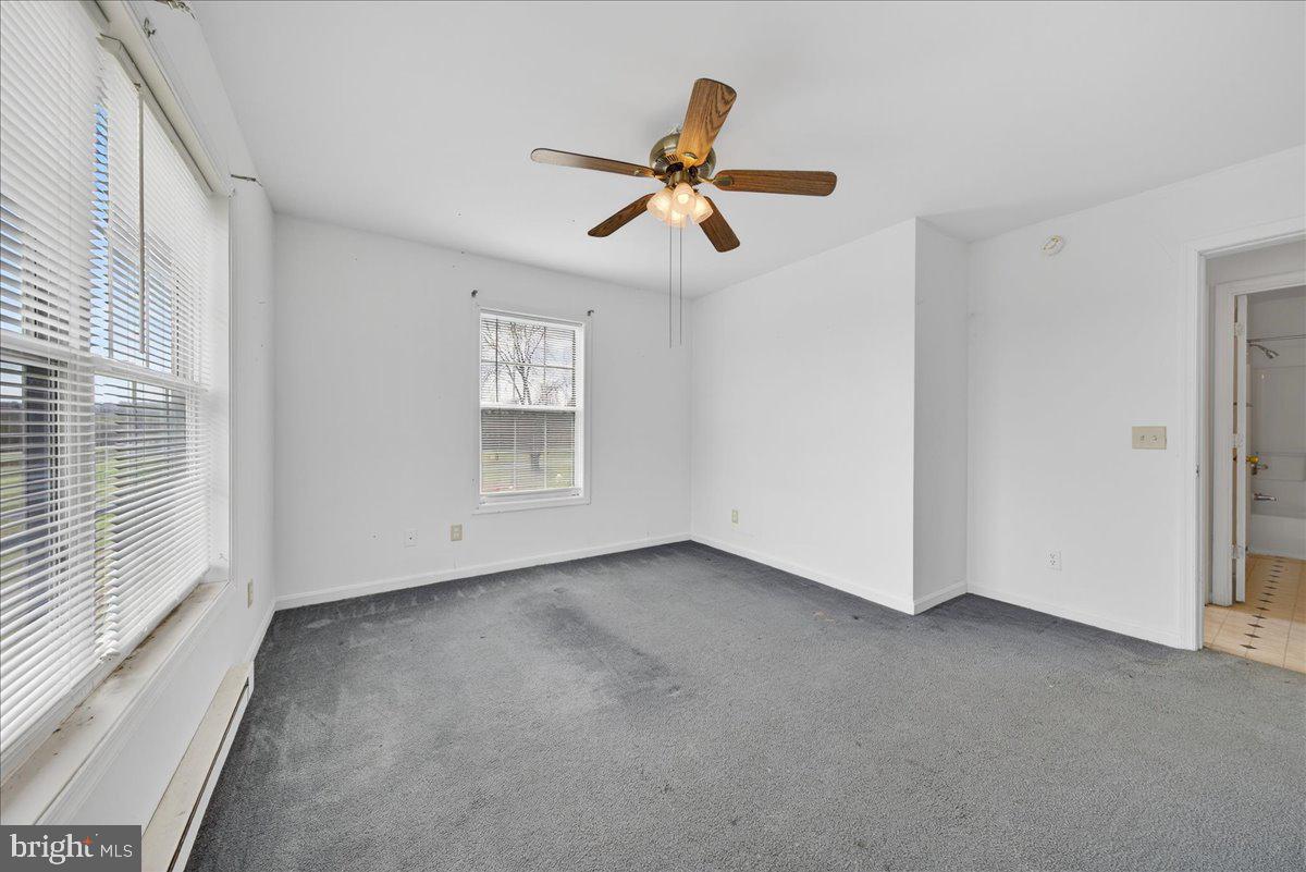 28042 Rapidan Road Rapidan, VA 22733 - Photo 33 of 72 a view of empty room with window and ceiling fan