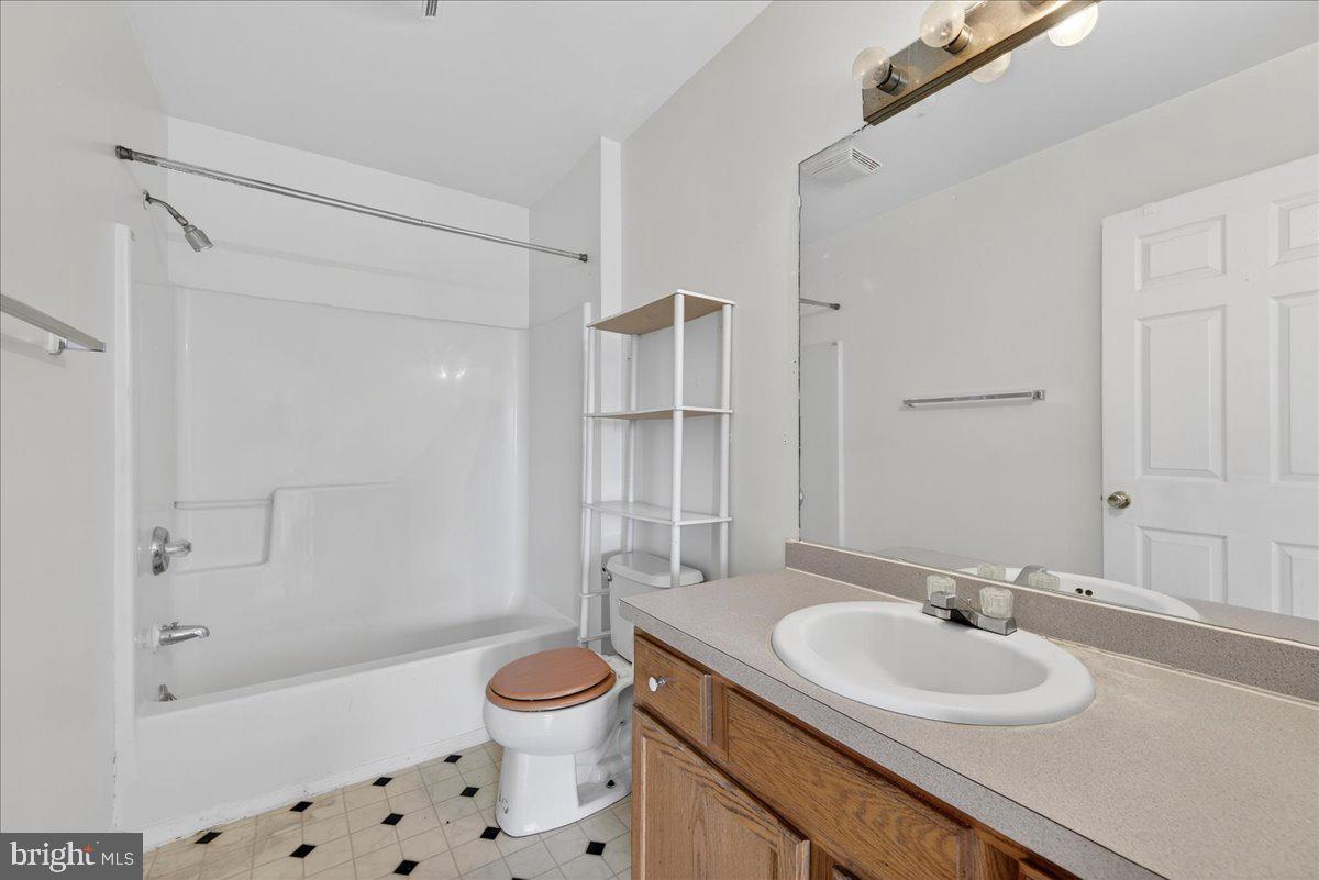 28042 Rapidan Road Rapidan, VA 22733 - Photo 36 of 72 a bathroom with a sink toilet tub and shower