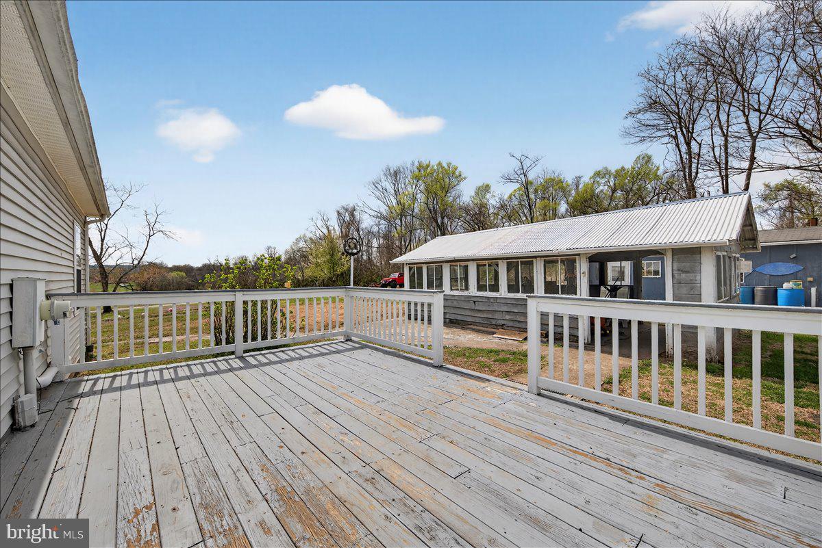 28042 Rapidan Road Rapidan, VA 22733 - Photo 37 of 72 a view of a house with a deck