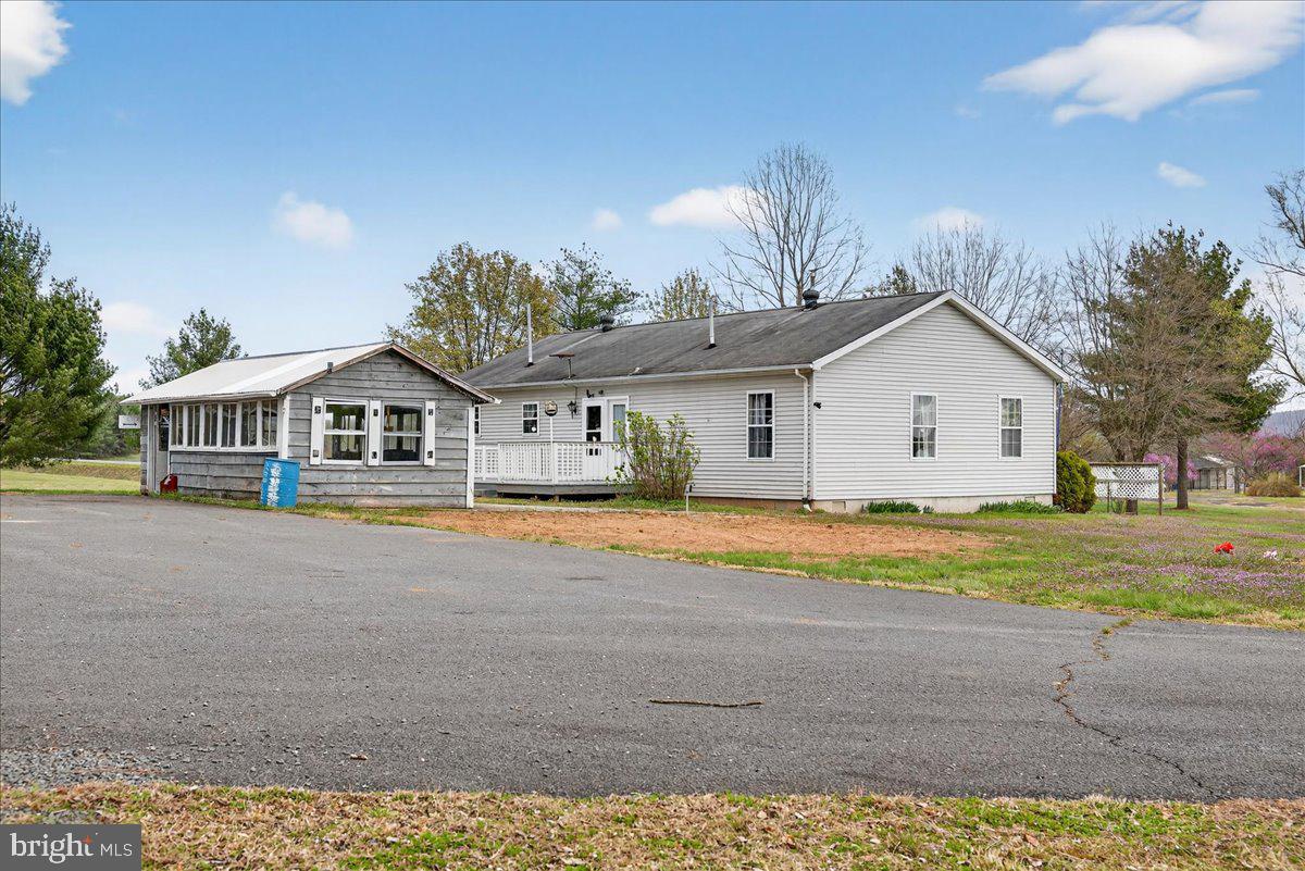 28042 Rapidan Road Rapidan, VA 22733 - Photo 48 of 72 a front view of a house with a yard and garage