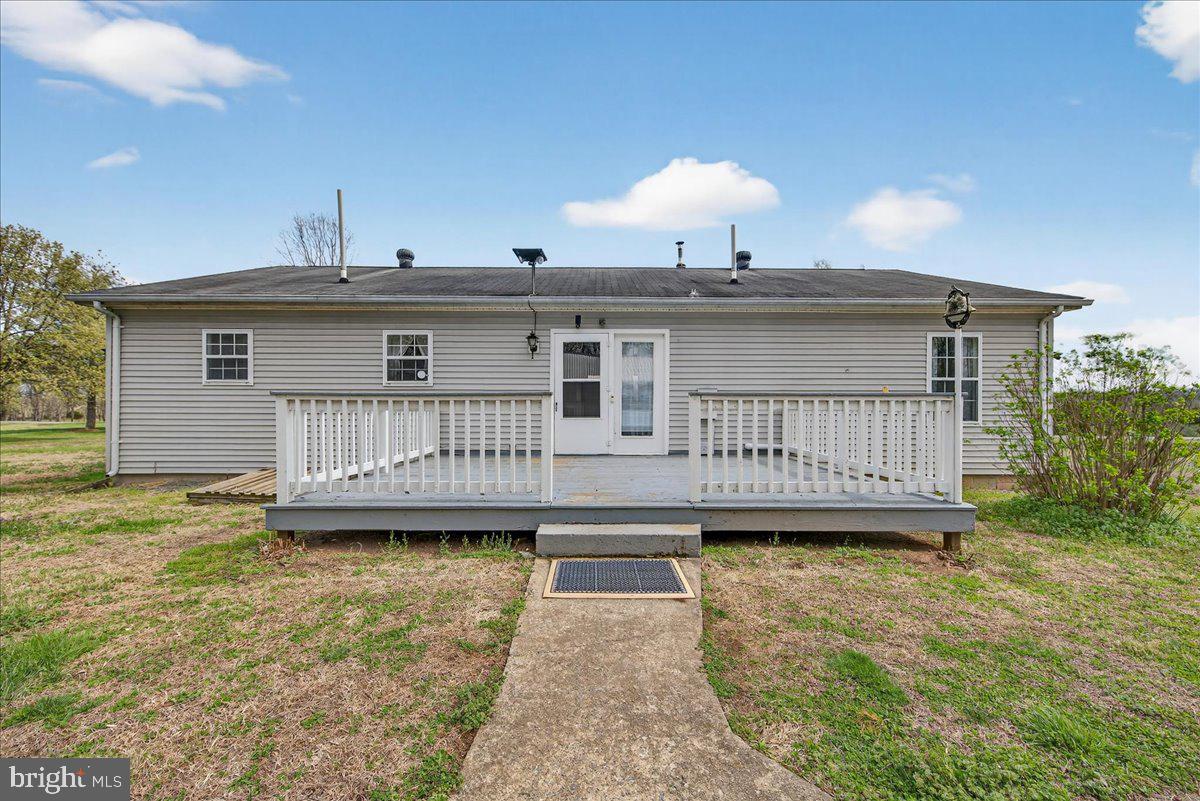 28042 Rapidan Road Rapidan, VA 22733 - Photo 7 of 72 a view of a house with a wooden deck and a yard