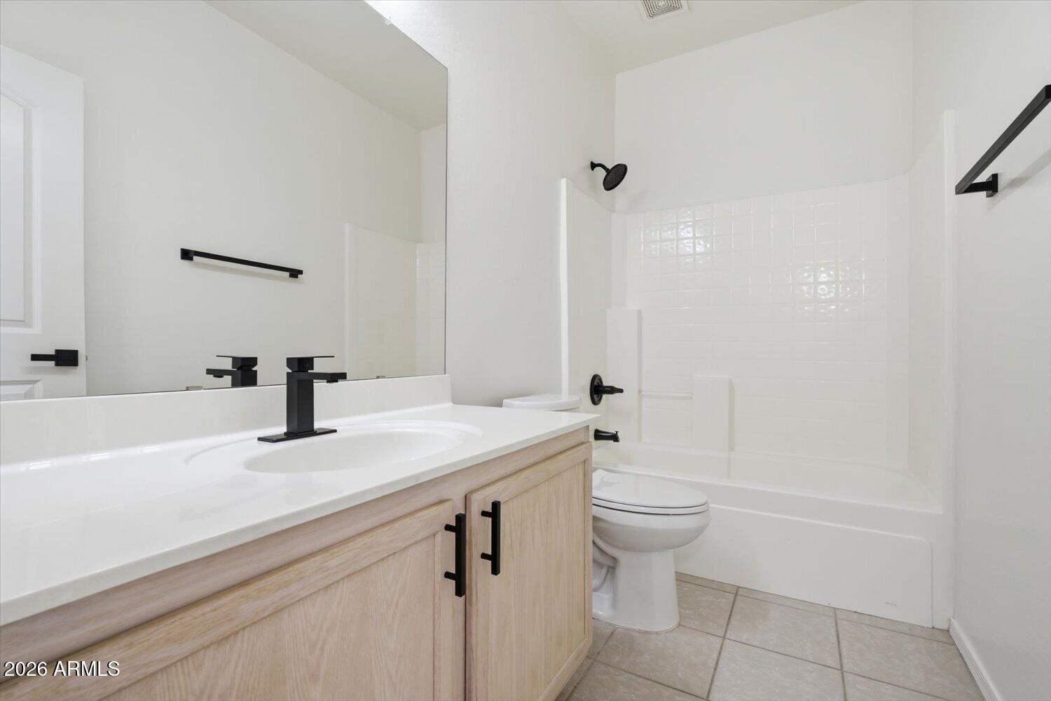 2565 South Signal Butte Road, Unit 23 Mesa, AZ 85209 - Photo 21 of 29 a bathroom with a sink a toilet and shower