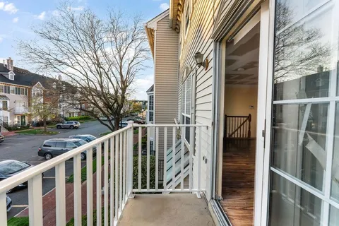 a view of a balcony with a bench
