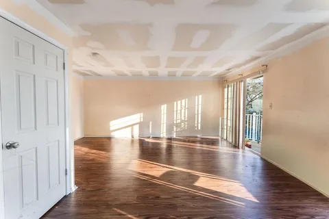 a view of an entryway with wooden floors