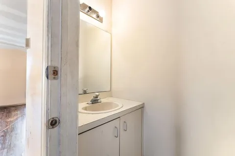 a bathroom with a sink and mirror