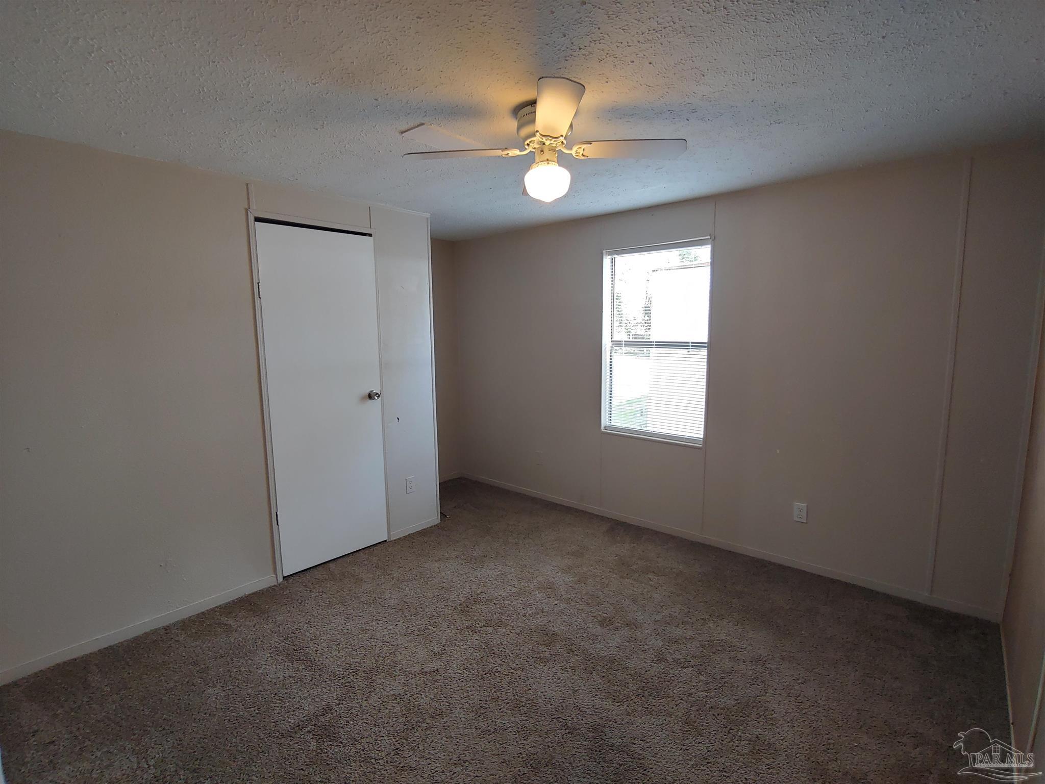 2821 Hillcrest Avenue, Unit 10 Pensacola, FL 32526 - Photo 11 of 14 a view of an empty room with a window