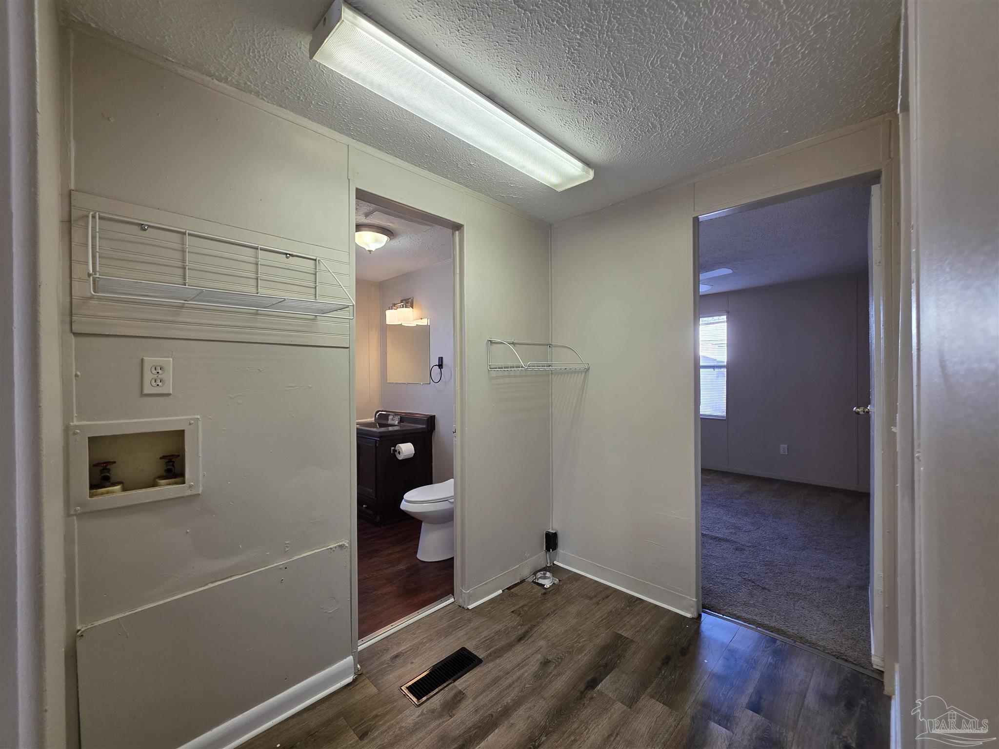 2821 Hillcrest Avenue, Unit 10 Pensacola, FL 32526 - Photo 13 of 14 a view of a room with wooden floor and bathroom