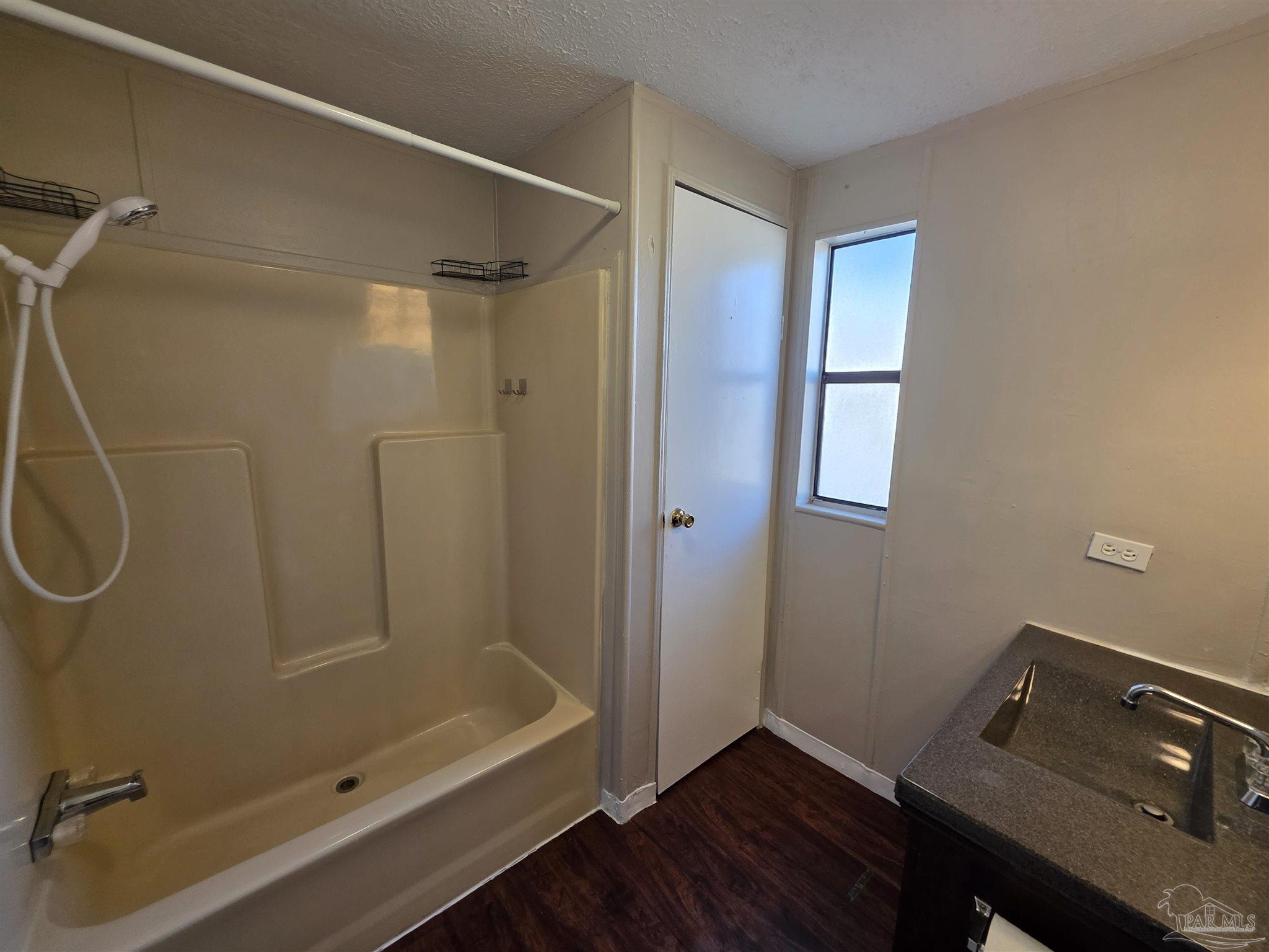 2821 Hillcrest Avenue, Unit 10 Pensacola, FL 32526 - Photo 10 of 14 a bathroom with a shower and a sink
