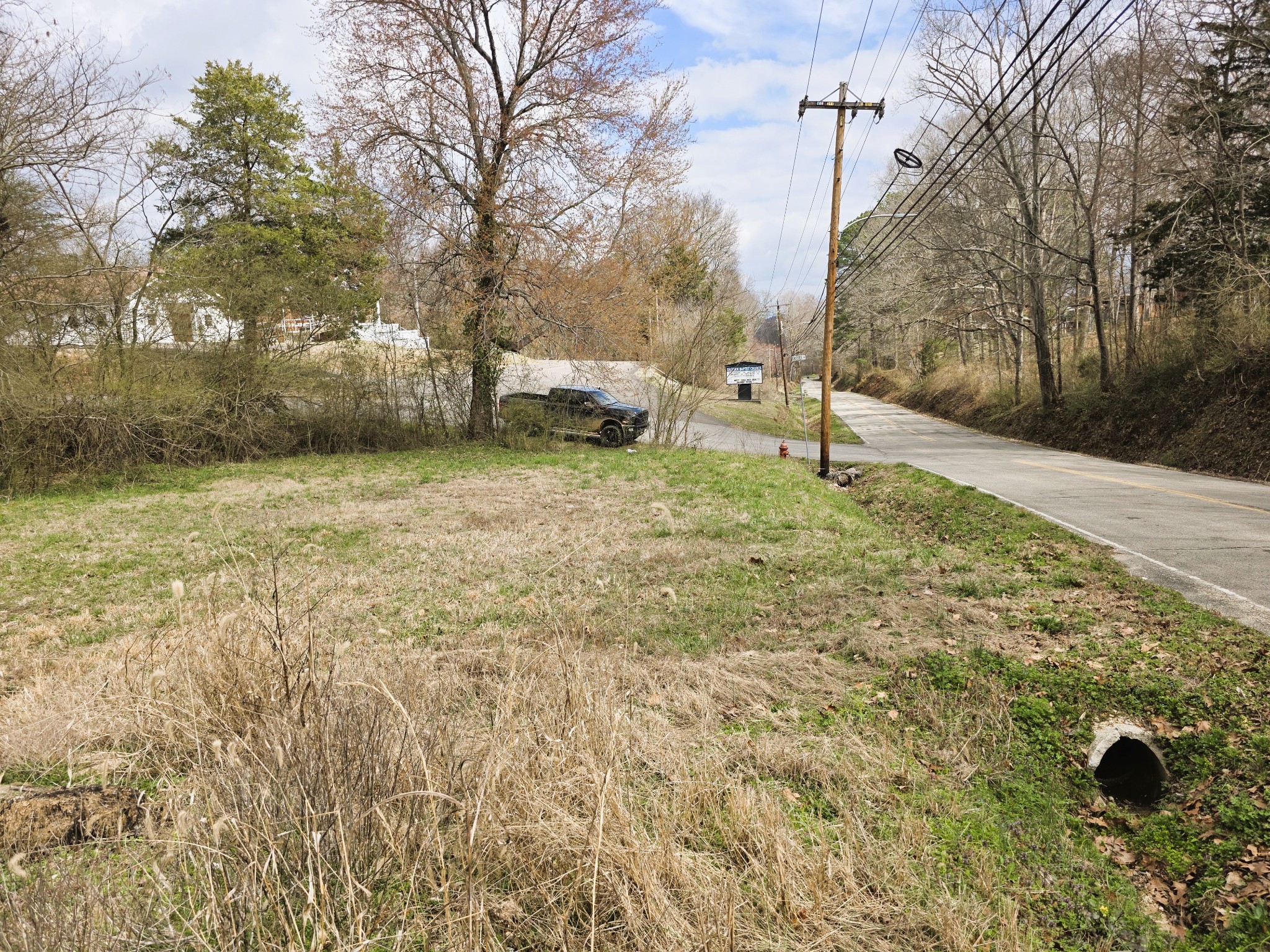 241 Stigall Street Camden, TN 38320 - Photo 6 of 10 a backyard of apartments with large trees