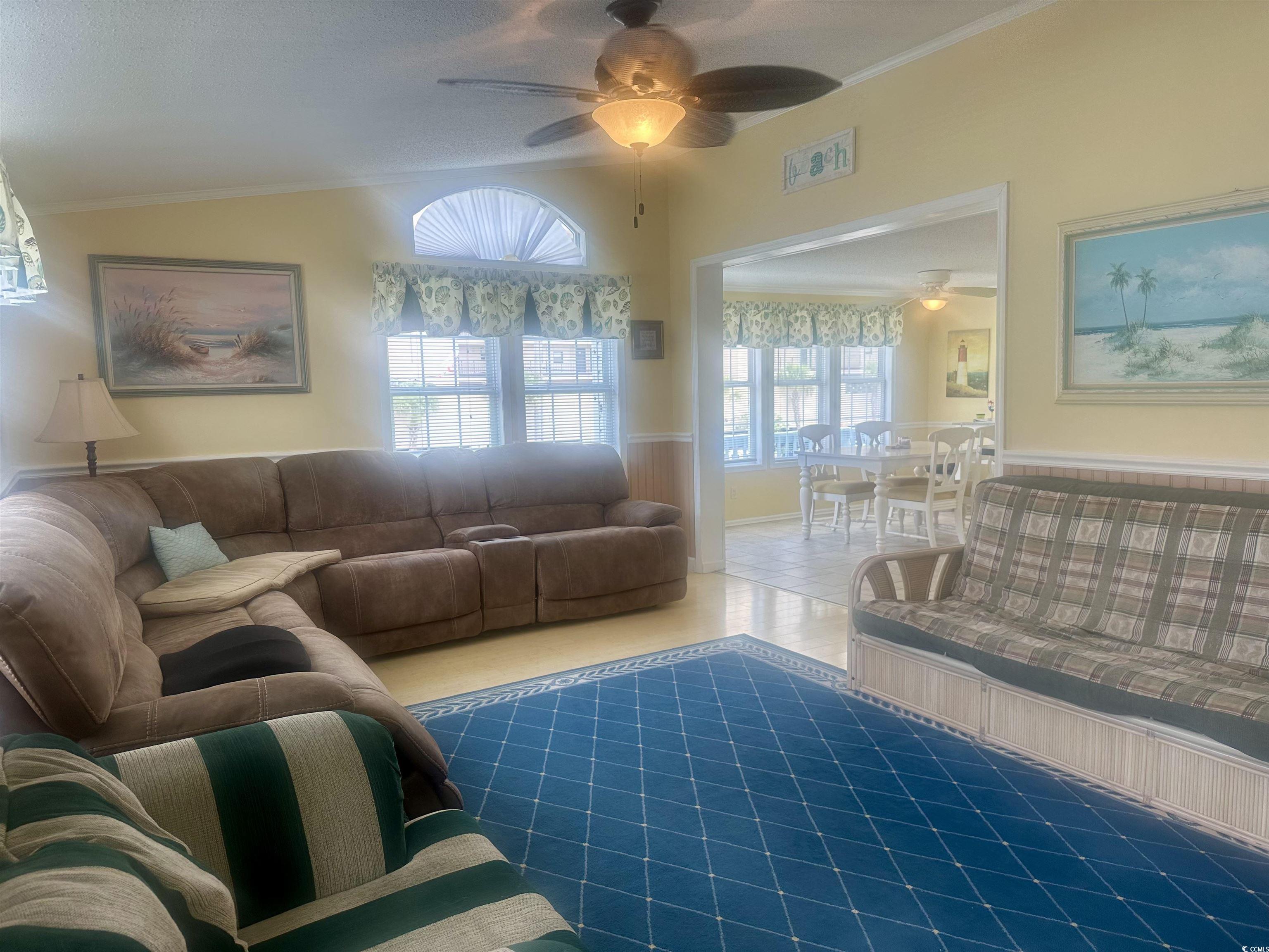 1752 Mason Circle Murrells Inlet, SC 29576 - Photo 21 of 31 Tiled living room with vaulted ceiling, ceiling fan, and a wealth of natural light