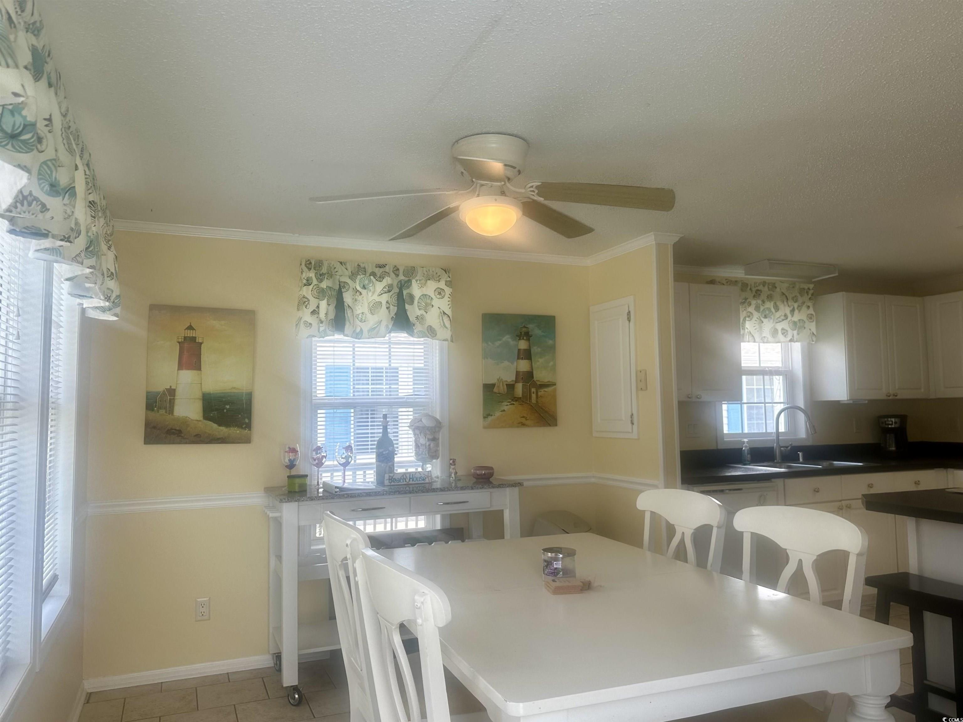 1752 Mason Circle Murrells Inlet, SC 29576 - Photo 4 of 31 Tiled dining area featuring sink, ceiling fan, and ornamental molding