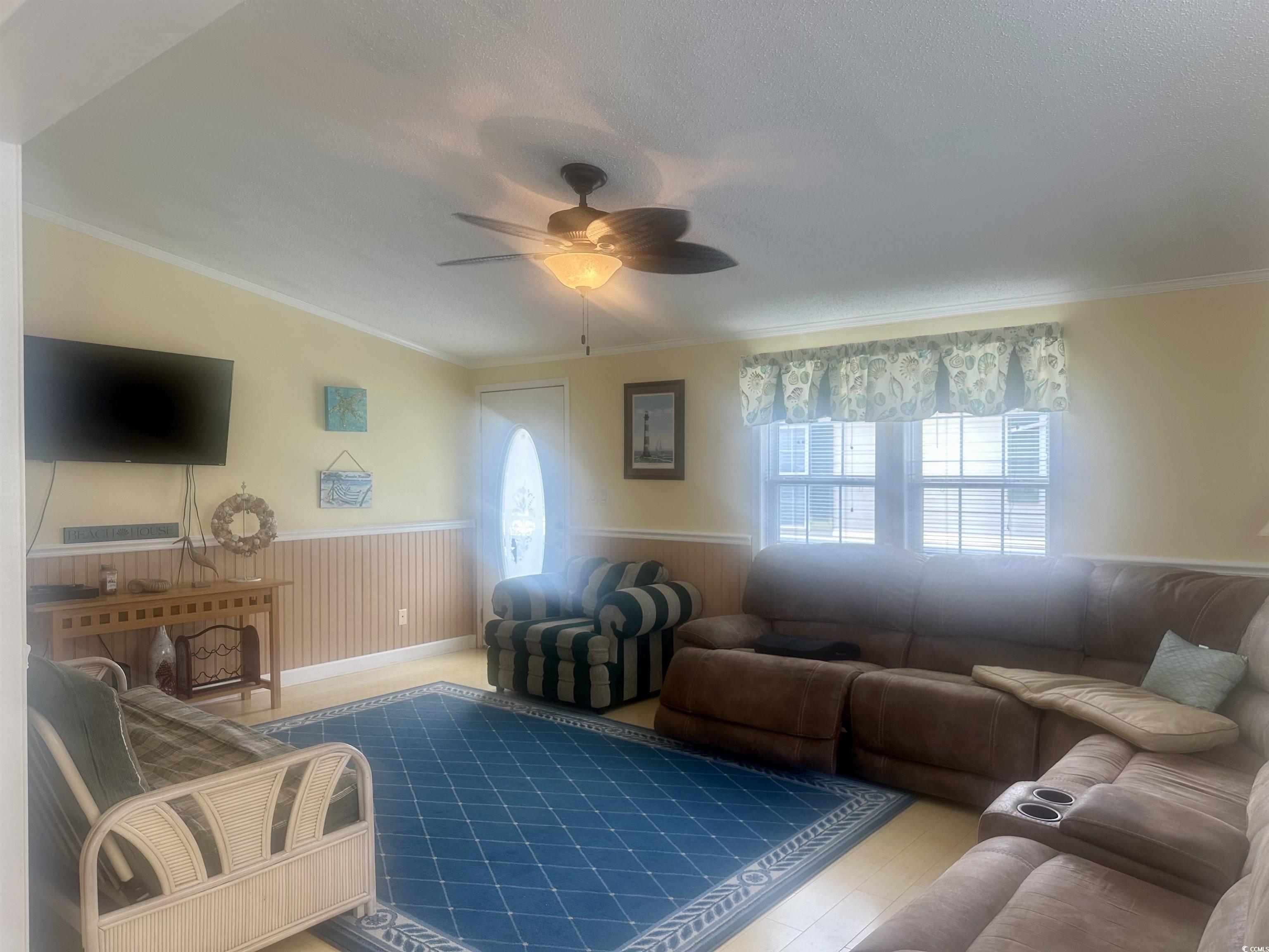 1752 Mason Circle Murrells Inlet, SC 29576 - Photo 6 of 31 Living room with ornamental molding, ceiling fan, and plenty of natural light