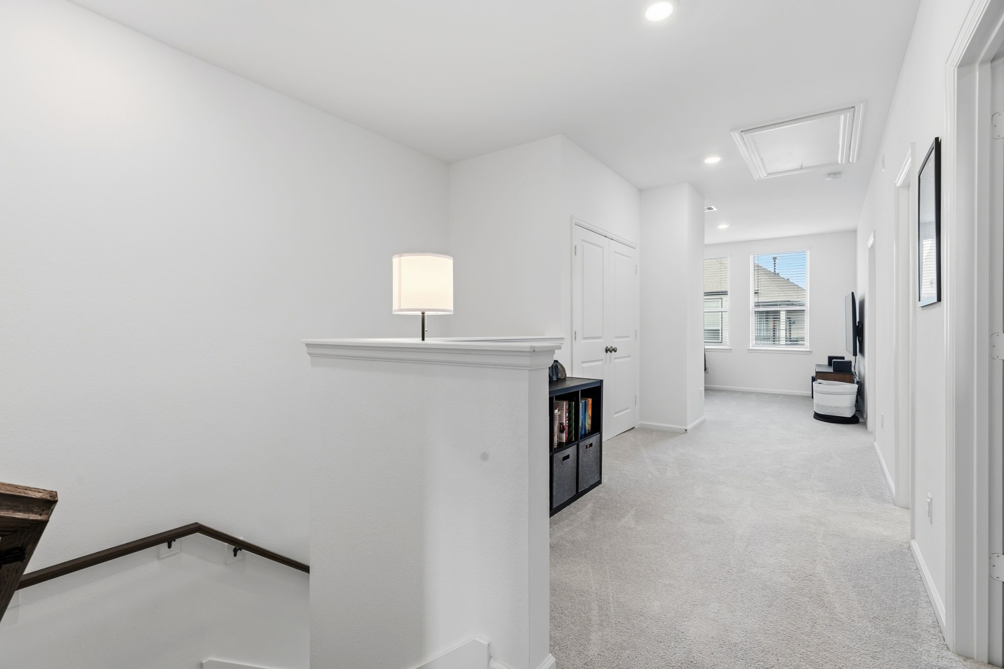 12902 Rio Medina Trail Cypress, TX 77433 - Photo 14 of 50 Now lets head upstairs. Nice big landing with plenty of room for another desk or bookshelves ! View looking into the game room..