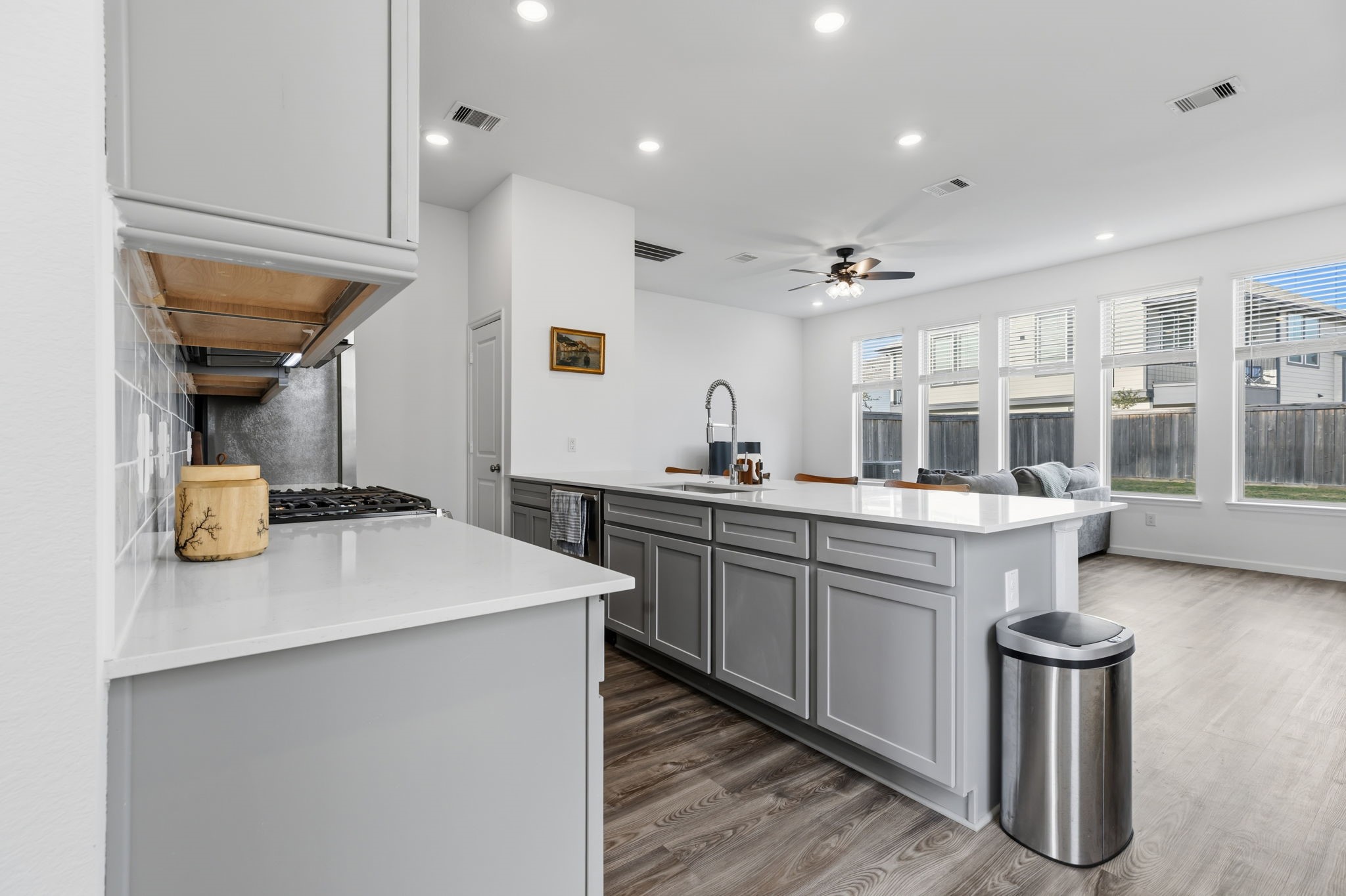 12902 Rio Medina Trail Cypress, TX 77433 - Photo 2 of 50 Huge living area with a wall of windows for plenty of nice bright light is open to the kitchen,