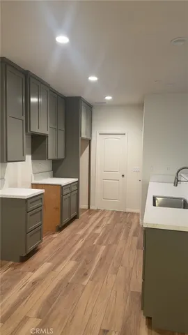 a view of a kitchen counter space and windows