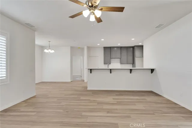 a bathroom with a granite countertop sink toilet a mirror and shower