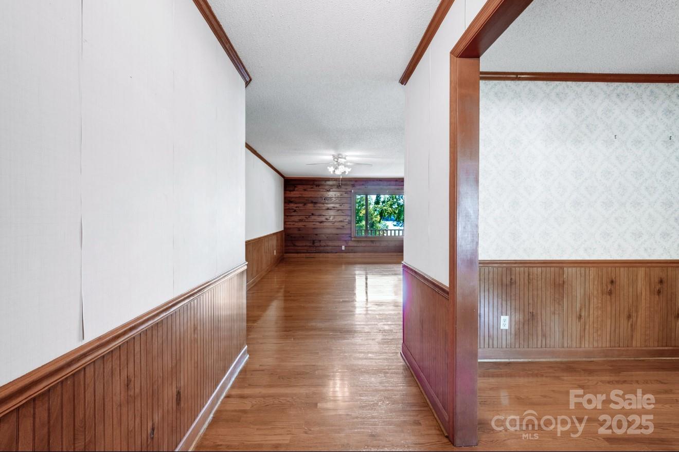 993 Jackson Road Fort Lawn, SC 29714 - Photo 14 of 48 a view of a hallway with wooden floor