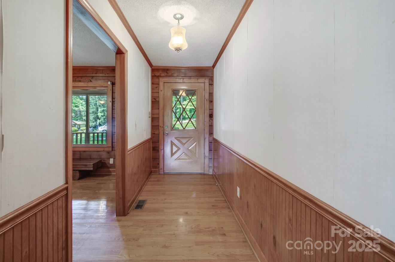 993 Jackson Road Fort Lawn, SC 29714 - Photo 15 of 48 a view of hallway with wooden floor and stairs
