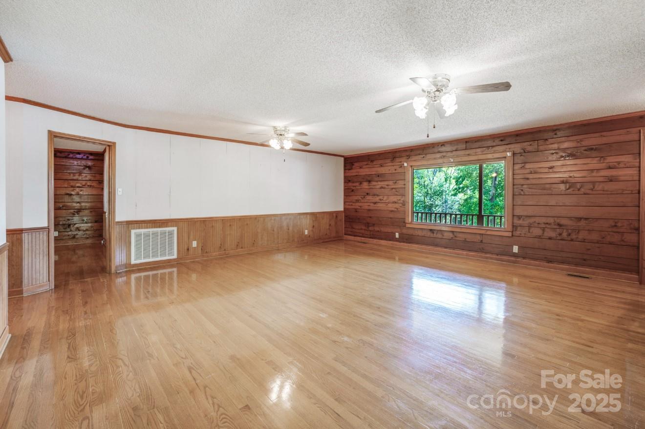 993 Jackson Road Fort Lawn, SC 29714 - Photo 17 of 48 a view of an empty room with wooden floor and a window
