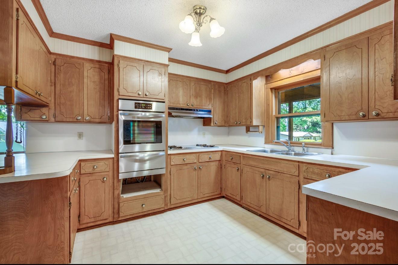 993 Jackson Road Fort Lawn, SC 29714 - Photo 22 of 48 a kitchen with stainless steel appliances granite countertop a sink and cabinets