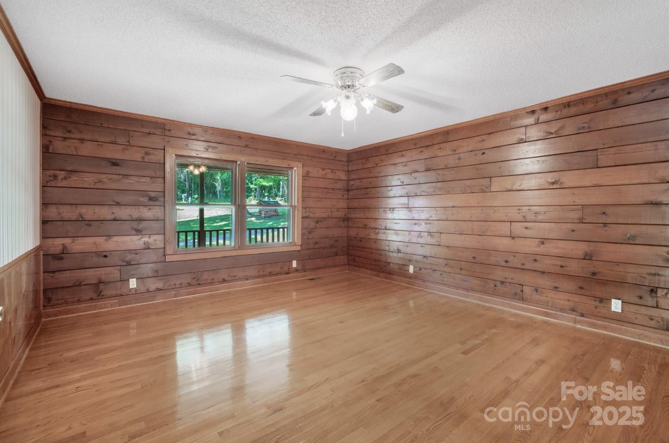 993 Jackson Road Fort Lawn, SC 29714 - Photo 28 of 48 a view of empty room with wooden floor and fan