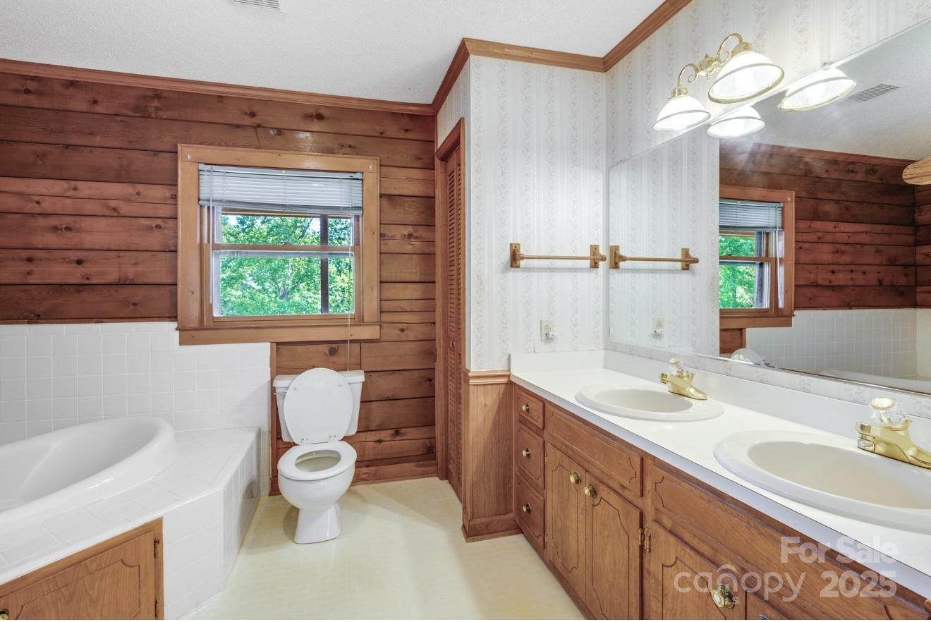 993 Jackson Road Fort Lawn, SC 29714 - Photo 32 of 48 a bathroom with a double vanity sink toilet and a mirror