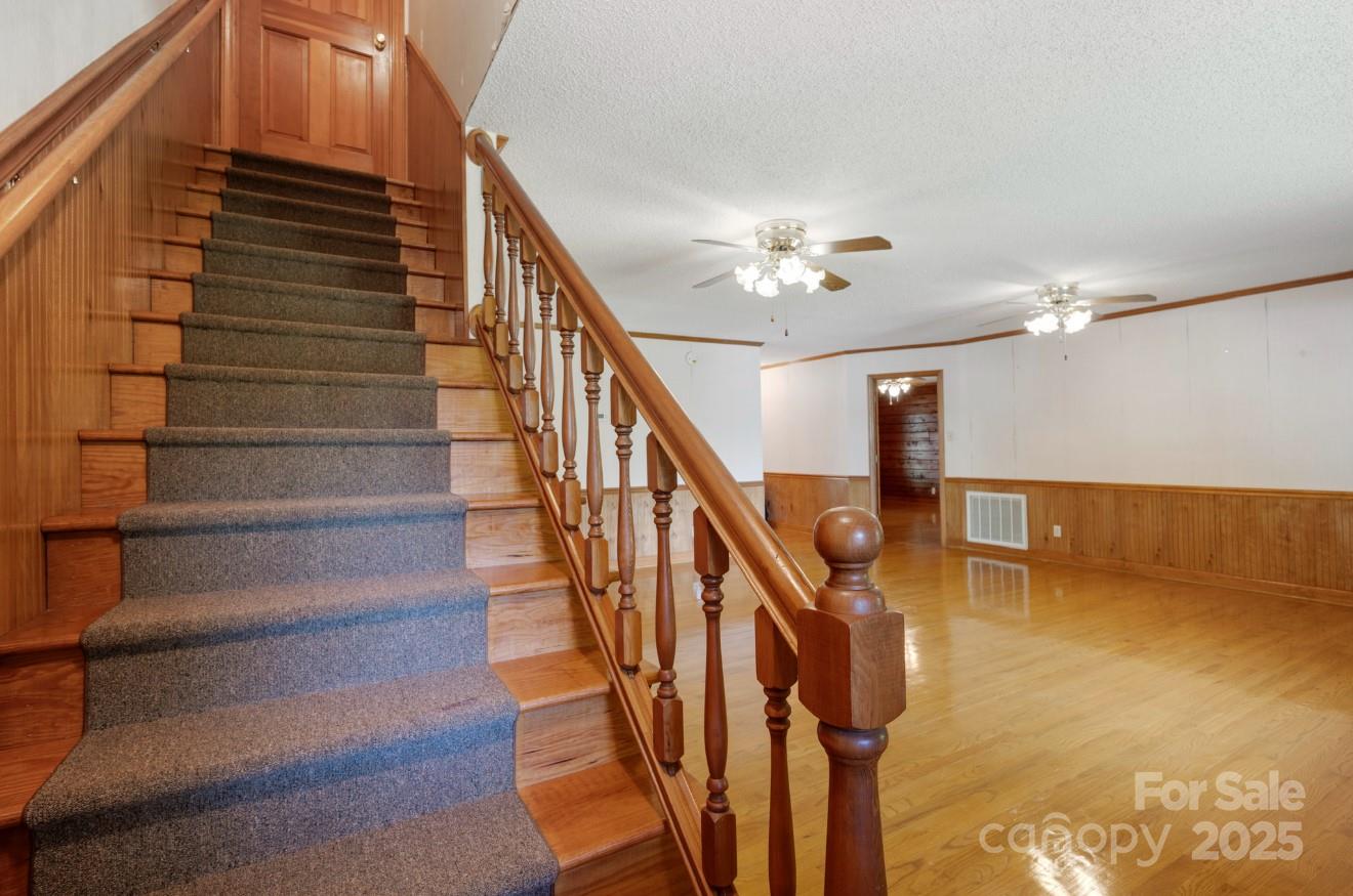 993 Jackson Road Fort Lawn, SC 29714 - Photo 35 of 48 a view of stairs and hall with wooden floor