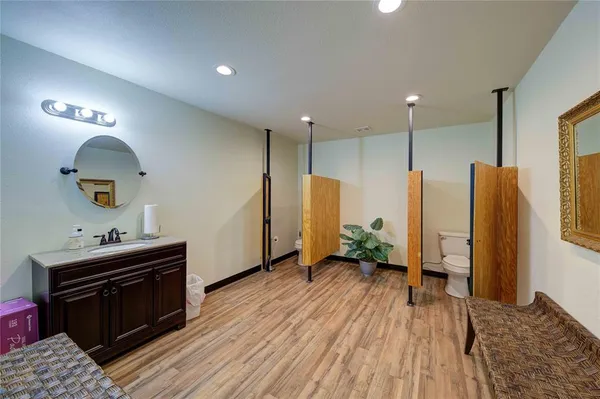 a view of room with window and wooden floor
