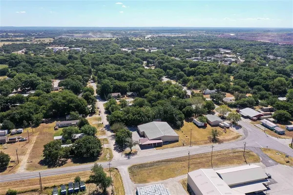 a view of a house with backyard and a outdoor space
