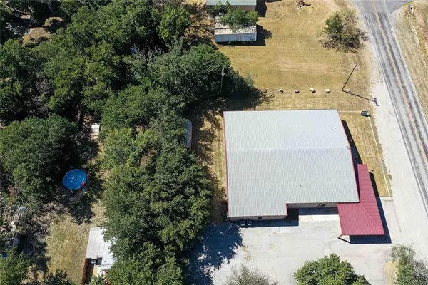 a backyard of a house with a tree