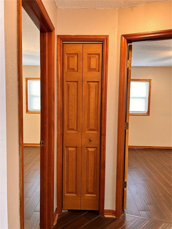 2284 Champlain Avenue Spring Hill, FL 34609 - Photo 22 of 28 an empty room with wooden floor and windows