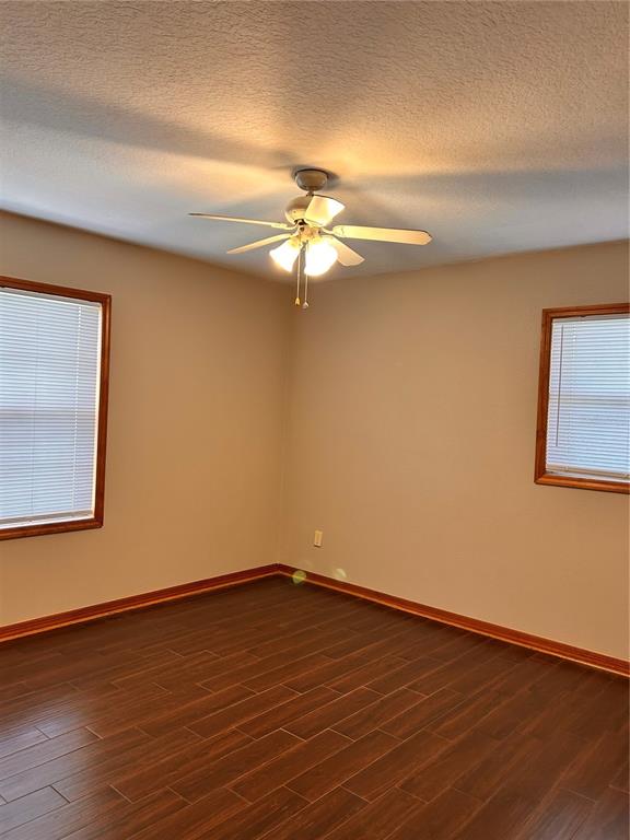2284 Champlain Avenue Spring Hill, FL 34609 - Photo 24 of 28 a view of a room with wooden floor and a ceiling fan