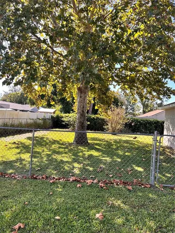 a view of yard with swimming pool