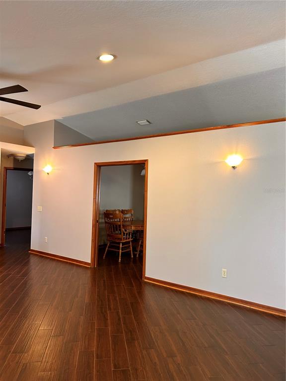 2284 Champlain Avenue Spring Hill, FL 34609 - Photo 4 of 28 an empty room with wooden floor and furniture