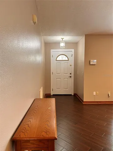 a view of a livingroom with wooden floor