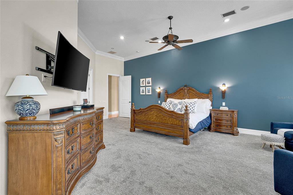 8707 Silverthorn Road Seminole, FL 33777 - Photo 16 of 58 a living room with furniture and a flat screen tv